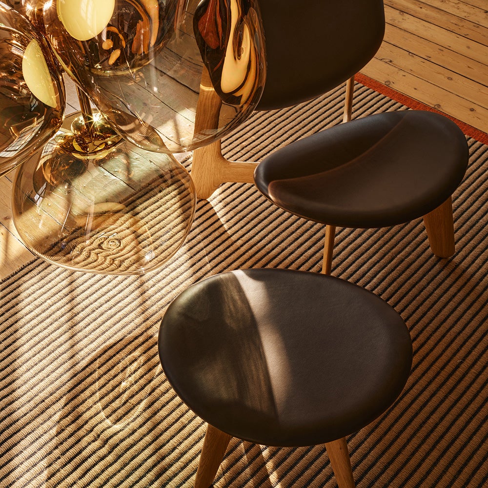 Slab ottoman natur svart läder 