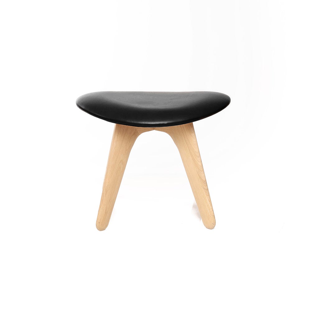 Slab ottoman natur svart läder 