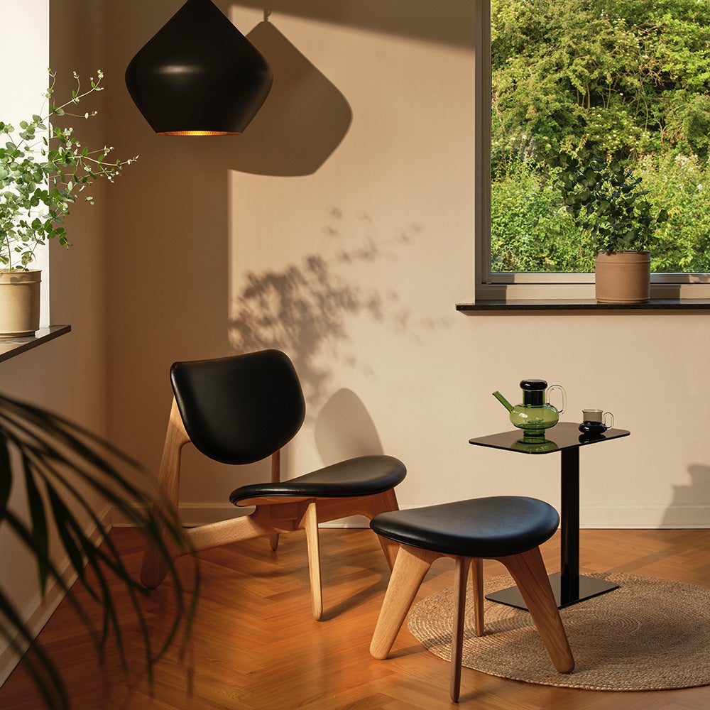 Slab ottoman natur svart läder 